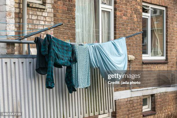 various laundry attached to a drying rack - drying rack stock pictures, royalty-free photos & images