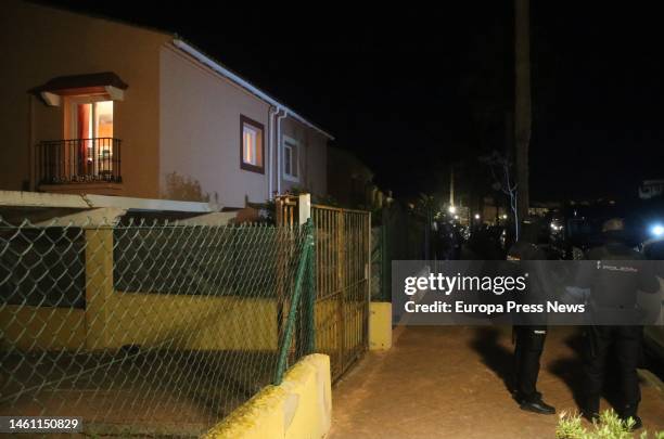 Several police officers guard the house where the bodies of a man and a woman were found shot dead on January 31, 2023 in La Linea . This afternoon,...