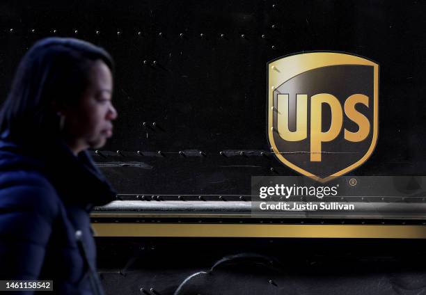Pedestrian walks by a United Parcel Service delivery truck on January 31, 2023 in San Francisco, California. UPS reported fourth quarter earnings...