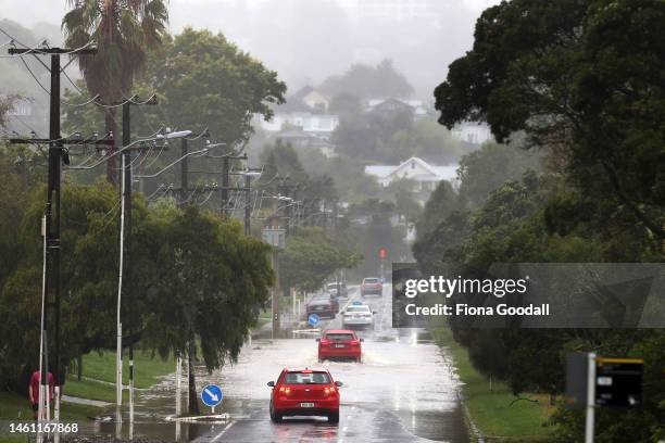 Cars drive along a flooded Portland Rd in Remuera on February 01, 2023 in Auckland, New Zealand. New Zealand's largest city, Auckland, was hit with a...