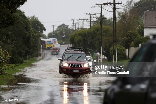 Cars drive along a flooded Portland Rd in Remuera on February 01, 2023 in Auckland, New Zealand. New Zealand's largest city, Auckland, was hit with a...