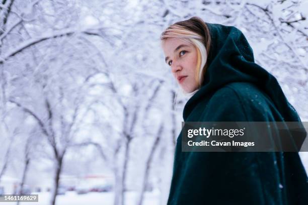 girl on a walk in snowy weather - real time stock pictures, royalty-free photos & images