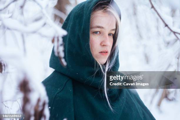 young woman portrait in snowy forest - real time stock pictures, royalty-free photos & images