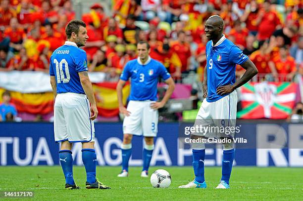 Mario Balotelli of Italy and Antonio Cassano of Italy share a joke during the UEFA EURO 2012 group C match between Spain and Italy at The Municipal...