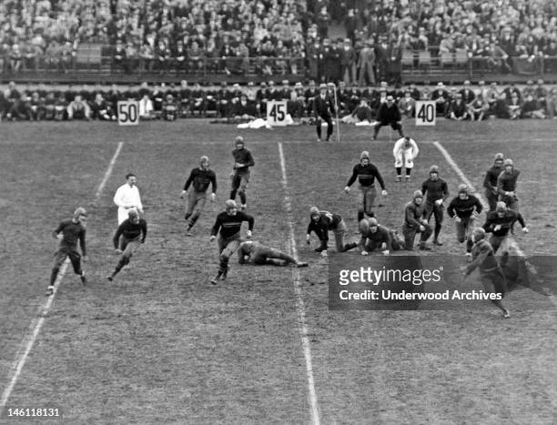 Notre Dame football player McGrath as he prepares to catch a forward pass from Walsh in a game against Army in Yankee Stadium, New York, New York,...