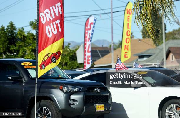 Vehicles sit for sale a used car lot on January 31, 2023 in Los Angeles, California. Prices and sales of used vehicles are falling from pandemic...