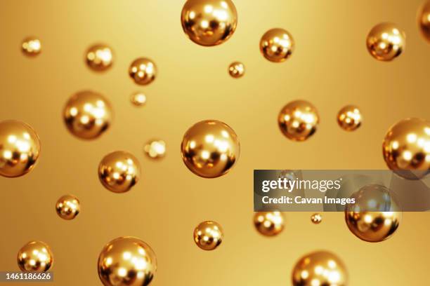 falling golden 3d christmas ball with pattern on gold background - christmas gold stock-fotos und bilder