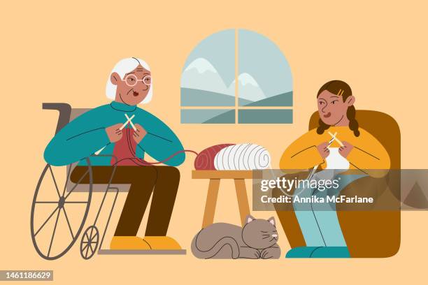 eine asiatische behinderte großmutter bringt ihrer enkelin das stricken bei - old granny knitting stock-grafiken, -clipart, -cartoons und -symbole