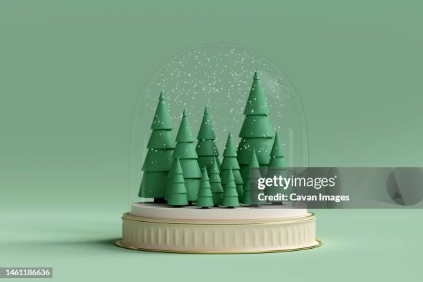 christmas trees inside snow dome. 3d render - snow globe imagens e fotografias de stock