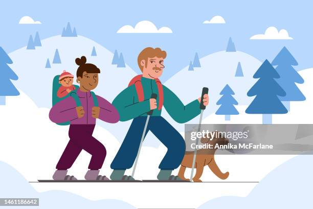 a mixed race couple snowshoes with their baby and dog in winter landscape - asian couple exercise stock illustrations