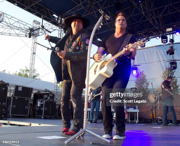 Eddie Montgomery and Troy Gentry of Montgomery Gentry performs during the 2012 Downtown Hoedown at Comerica Park on June 9, 2012 in Detroit, Michigan.