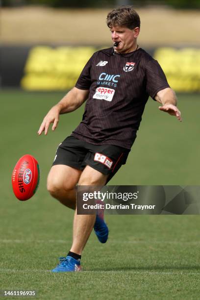 Assistant coach Robert Harvey kicks the ball during a St Kilda Saints AFL training session at RSEA Park on February 01, 2023 in Melbourne, Australia.