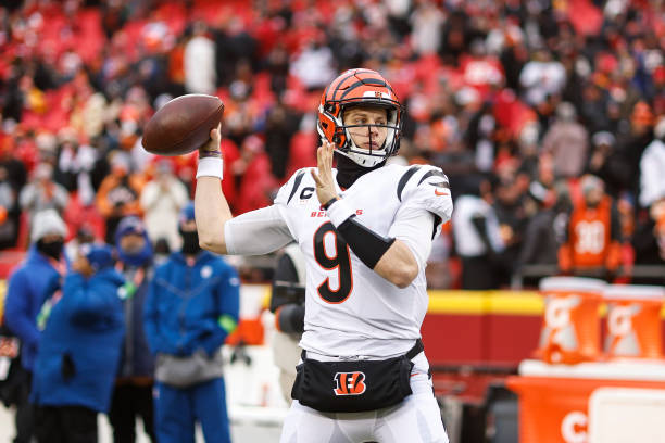 Joe Burrow of the Cincinnati Bengals passes as he warms up prior to the AFC Championship NFL football game between the Kansas City Chiefs and the...
