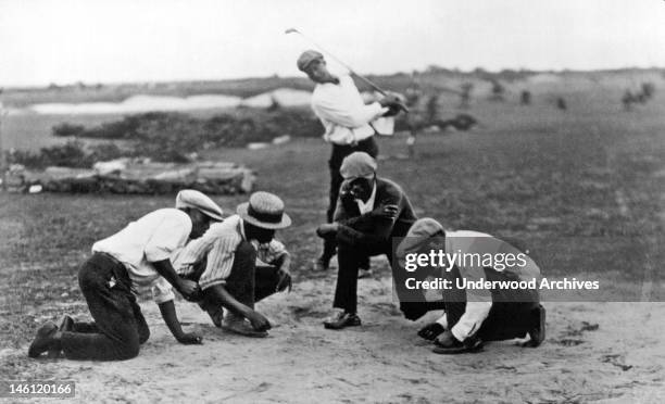 Caddies at the Hialiah Country Club in Miami play the game known as 'African golf,' where sevens are good and boxcars spell defeat, Miami, Florida,...