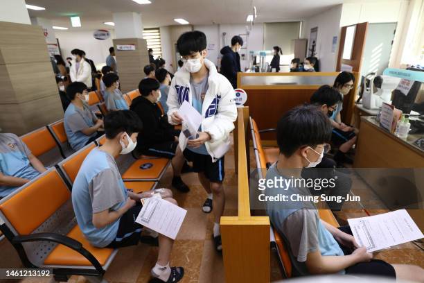 Teenager has their vision tested during physical examinations for conscription at the Military Manpower Administration on February 01, 2023 in Seoul,...