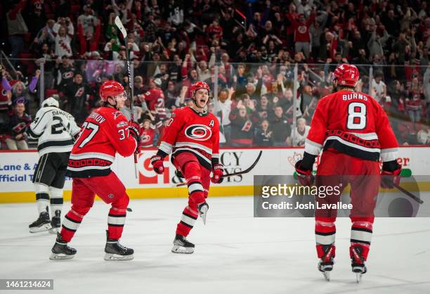 Sebastian Aho of the Carolina Hurricanes celebrates after scoring the game-winning goal in overtime to defeat the Los Angeles Kings at PNC Arena on...