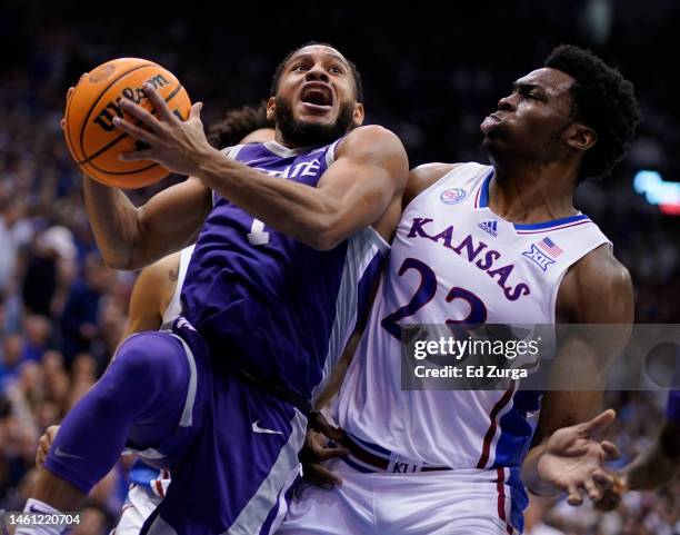 Markquis Nowell of the Kansas State Wildcats goes up for a basket against Ernest Udeh Jr. #23 of the Kansas Jayhawks in the second half at Allen...