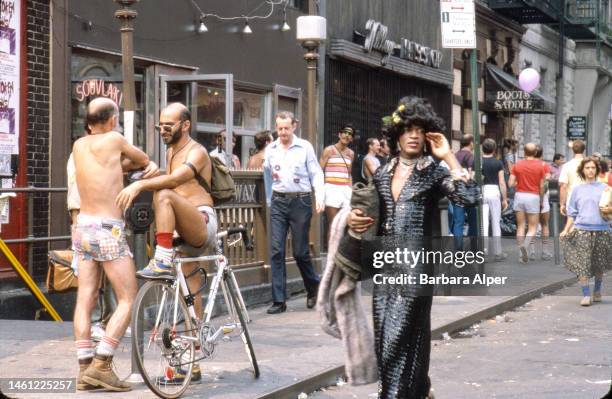 American gay liberation activist Marsha P Johnson , along with unidentified others, on the corner of Christopher Street and 7th Avenue during the...