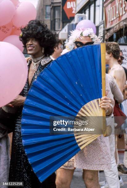 American gay liberation activist Marsha P Johnson , along with unidentified others, on the corner of Christopher Street and 7th Avenue during the...