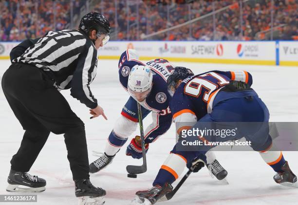 Boone Jenner of the Columbus Blue Jackets face off against Connor McDavid of the Edmonton Oilers in the first period on January 25, 2023 at Rogers...