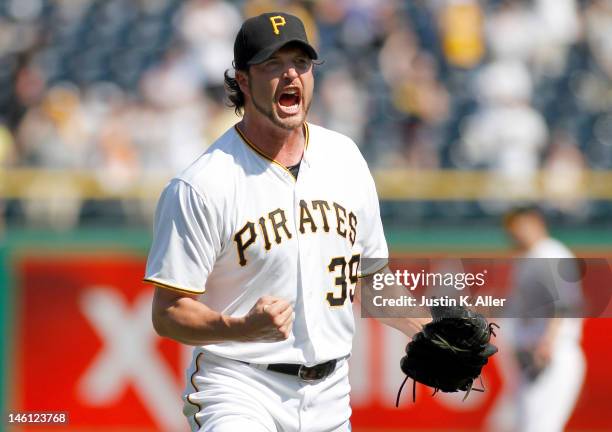 Jason Grilli of the Pittsburgh Pirates reacts after striking out the last batter in the ninth inning against the Kansas City Royals during...