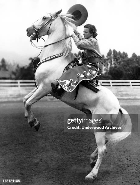 Year old cowgirl from Santa Barbara who will participate in the annual California Rodeo at Salinas this year, Santa Barbara, California, 1934.