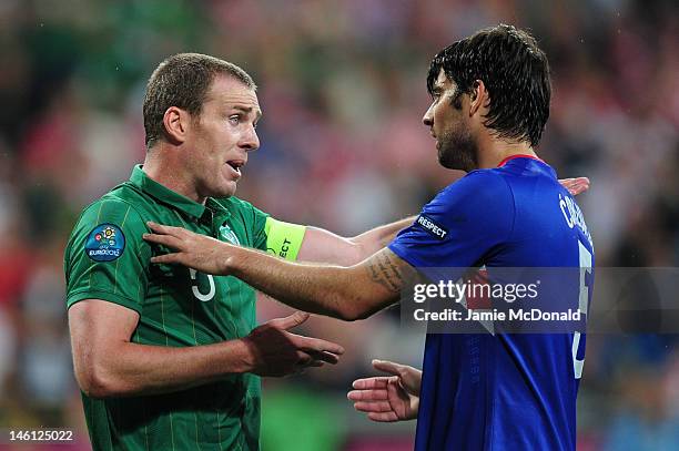 Richard Dunne of Republic of Ireland has words with Vedran Corluka of Croatia during the UEFA EURO 2012 group C between Ireland and Croatia at The...