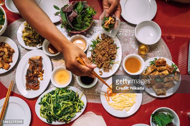 top view of different dishes in vietnamese restaurant - vietnamese food stockfoto's en -beelden