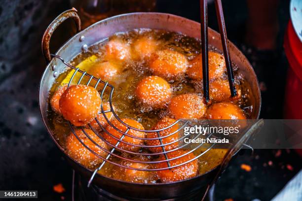 fried dough at sunday market in bac ha, northern vietnam - vietnam and street food stock pictures, royalty-free photos & images