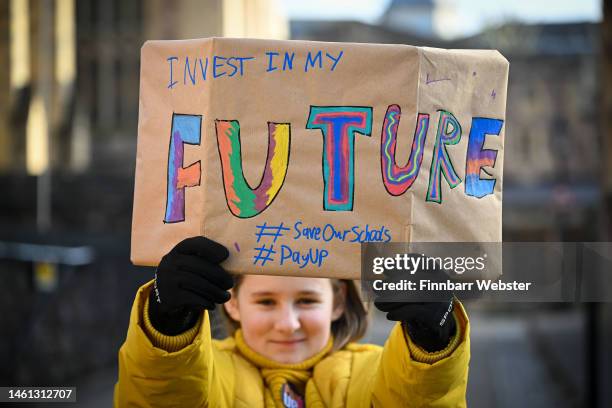 Child holds up a placard during the strike outside Bristol Cathedral Choir School, on February 01, 2023 in Bristol, England. Public sector union...