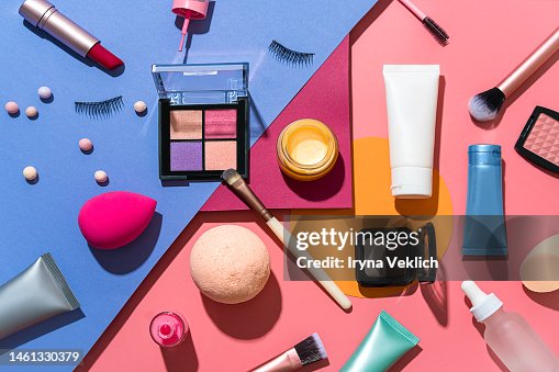 Set of Beauty Products Laid Out on a Multi-Color Background. Cosmetic Make-up products for a woman Make-Up Brush, Red Lipstick, False Eyelashes, Face Powder Blush Palette, Eyeshadow, Face Cream Hand Cream, Beauty Blender Sponges, Face Serum and Lip Balm. Set of Beauty Products Laid Out on a Multi-Color Background. Cosmetic Make-up products for a woman Make-Up Brush, Red Lipstick, False Eyelashes, Face Powder Blush Palette, Eyeshadow, Face Cream Hand Cream, Beauty Blender Sponges, Face Serum and Lip Balm.