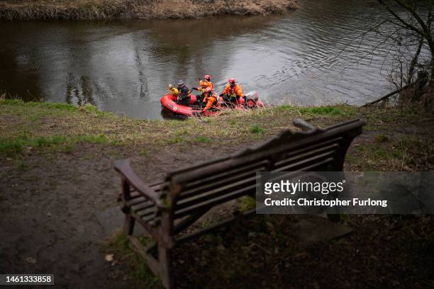 Search dog from Lancashire Police and a crew from Lancashire Fire and Rescue service search the River Wyre for missing woman Nicola Bulley, near the...