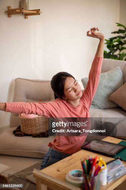 young female inventor relaxing her body from hard work - hands on a hard body stock pictures, royalty-free photos & images