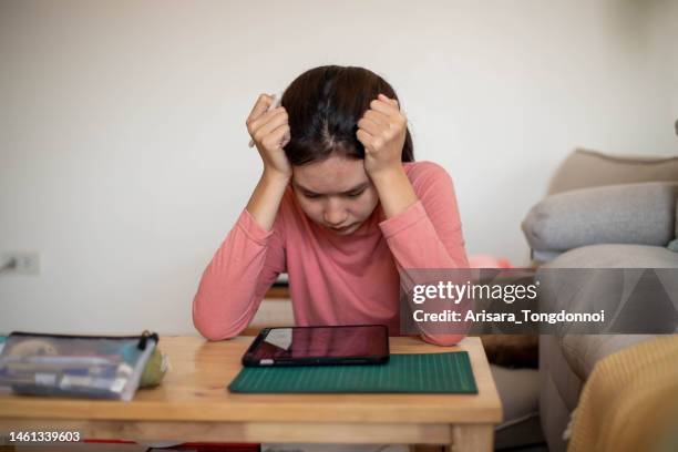 an inventive young woman thinking hard about her design. - hands on a hard body stock pictures, royalty-free photos & images