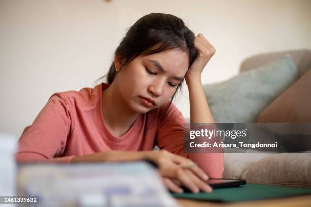 an inventive young woman thinking hard about her design. - hands on a hard body stock pictures, royalty-free photos & images