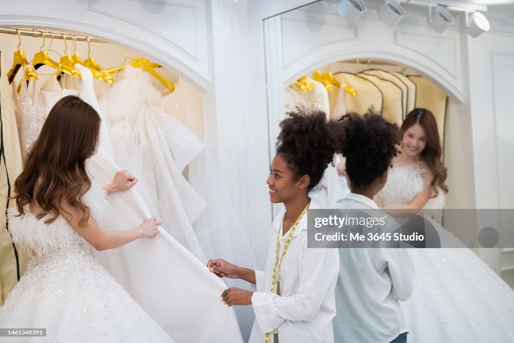 The Tailor Designs The Wedding Dress For The Bride High-Res Stock Photo ...