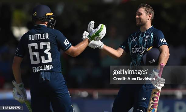 England batsmen Dawid Malan celebrates his century with Jos Buttler during the 3rd ODI match between South Africa and England at De Beers Diamond...