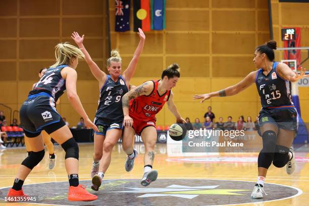 Robbi Ryan of the Lynx drives to the key against Shyla Heal of the Fire during the round 13 WNBL match between Perth Lynx and Townsville Fire at...