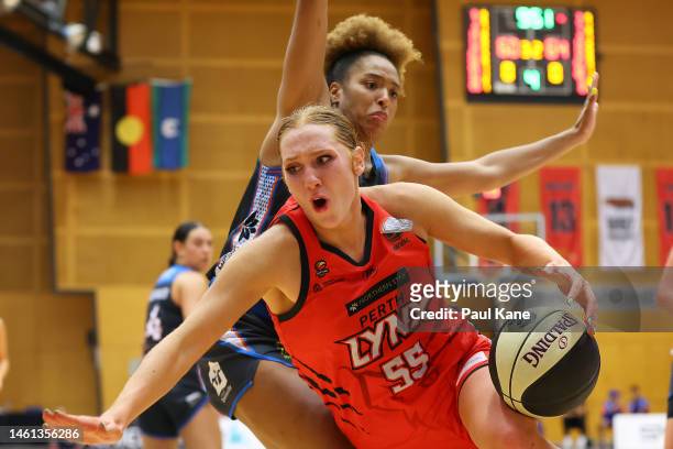 Chloe Bibby of the Lynx gets fouled by Tianna Hawkins of the Fire during the round 13 WNBL match between Perth Lynx and Townsville Fire at Bendat...