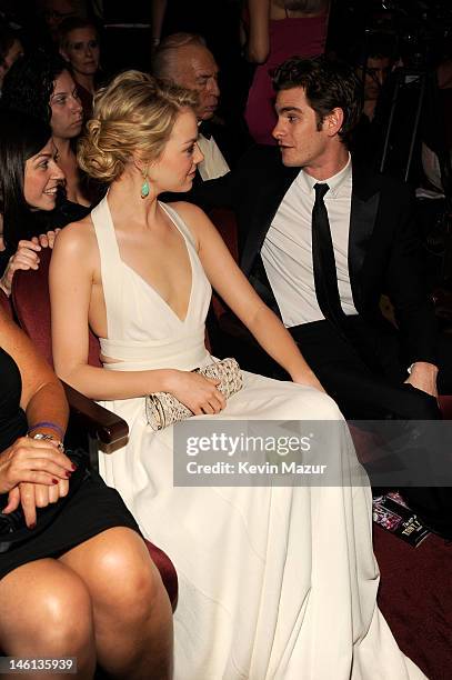 Actress Emma Stone and nominee Andrew Garfield attend the 66th Annual Tony Awards at The Beacon Theatre on June 10, 2012 in New York City.