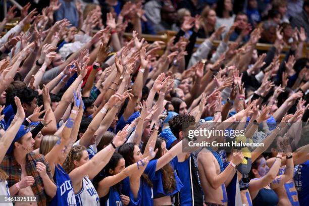 Duke Blue Devils fans watch as their team takes a free throw against the Wake Forest Demon Deacons during their game at Cameron Indoor Stadium on...