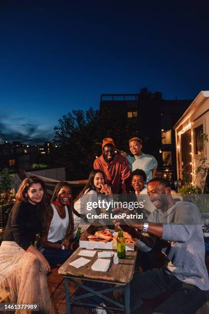 friends having fun at a party and take a selfie at the dining table - reünie sociaal stockfoto's en -beelden