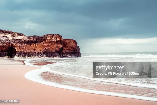 scenic view of beach against sky - p&g stock pictures, royalty-free photos & images