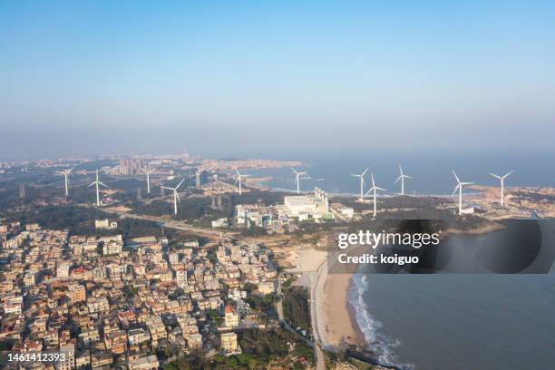 aerial photography of seaside wind farm - windmaschine stock-fotos und bilder