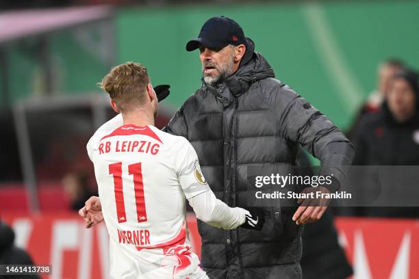 Timo Werner of RB Leipzig celebrates with Marco Rose, Head Coach of RB Leipzig, after scoring the team's third goal during the DFB Cup round of 16...