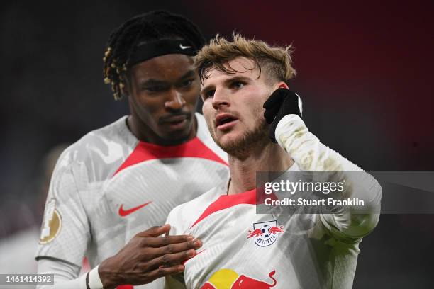 Timo Werner celebrates after scoring the team's third goal with Mohamed Simakan of RB Leipzig during the DFB Cup round of 16 match between RB Leipzig...