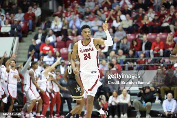 Brandon Miller of the Alabama Crimson Tide acknowledges the fans and teammates after knocking down a second half three pointer against the Vanderbilt...