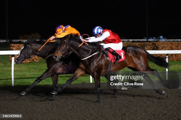 Adam Kirby riding Positive overtakes Kieran O'Neill on Naval Commander to win the The Unibet 3 Uniboosts A Day Handicap Stakes at Kempton Park on...