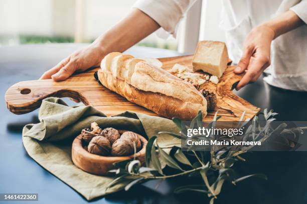 cheese platter. close-up of food on cutting board. - cheese platter stock-fotos und bilder