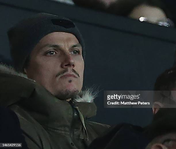 Marcel Sabitzer of Manchester United watches from the directors box ahead of the Carabao Cup Semi Final 2nd Leg match between Manchester United and...